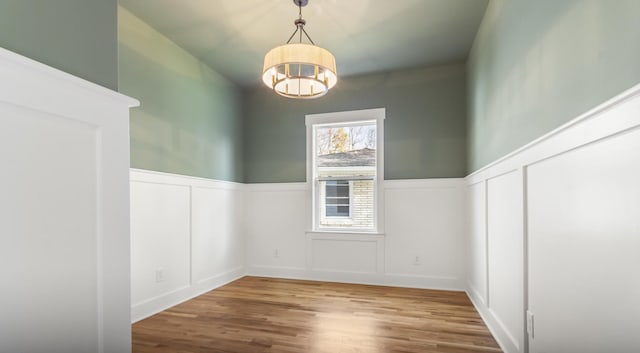 interior space with a chandelier and hardwood / wood-style flooring