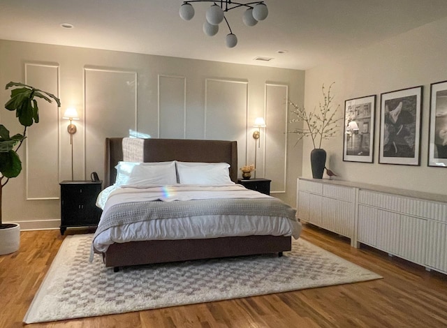 bedroom with wood-type flooring