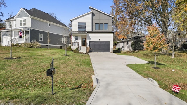 view of property with a front yard and a garage