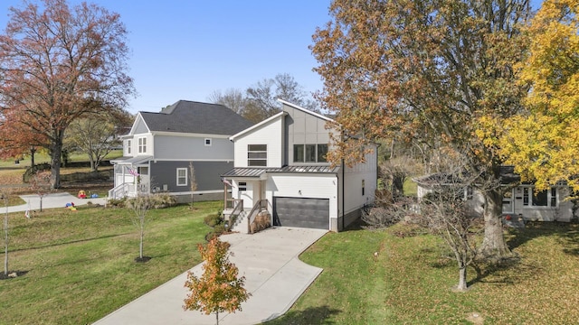 view of front of house featuring a front lawn and a garage