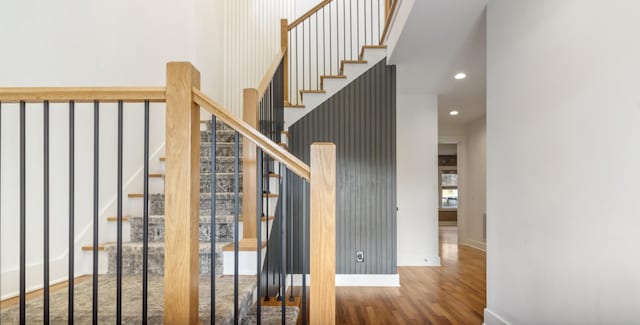 stairway featuring hardwood / wood-style floors