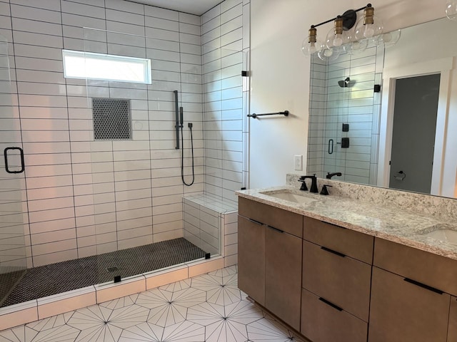 bathroom featuring vanity, tile patterned floors, and walk in shower