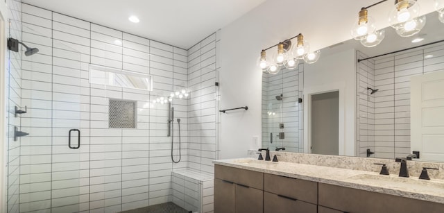 bathroom with an enclosed shower and vanity