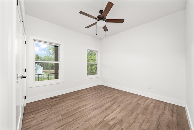 empty room featuring light wood-type flooring and ceiling fan