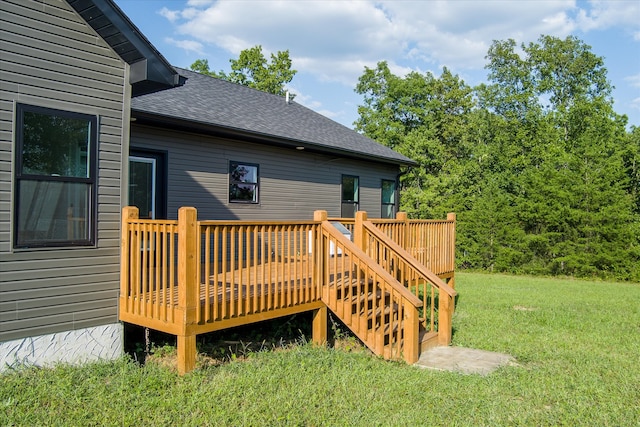 wooden terrace with a lawn