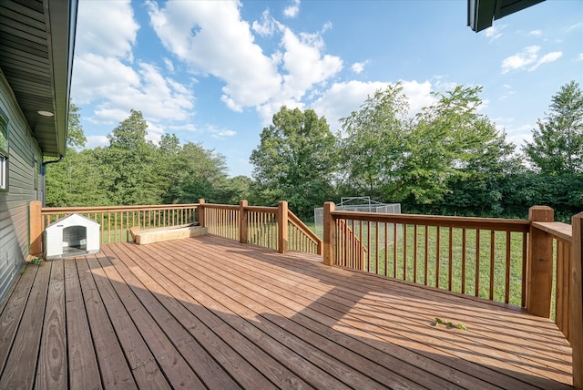 wooden deck with a yard