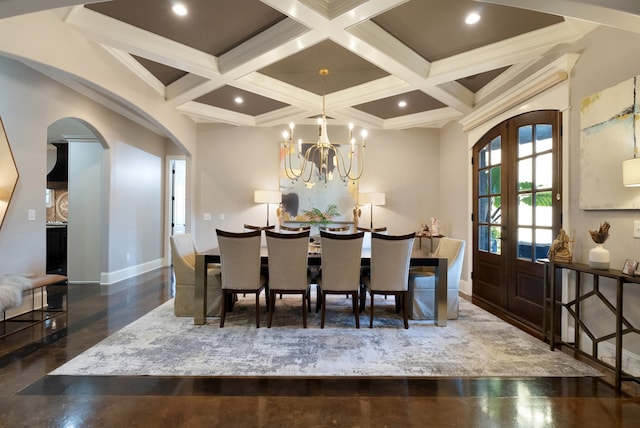 dining area featuring french doors, coffered ceiling, and beamed ceiling