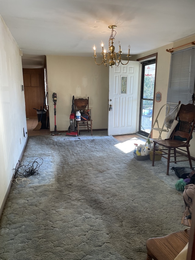 interior space with a notable chandelier and carpet flooring