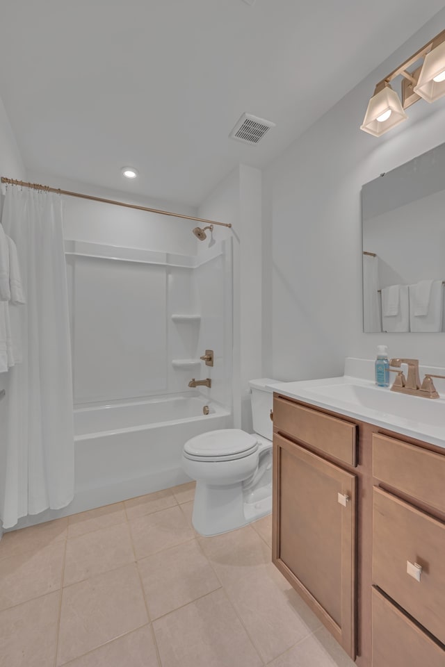 full bathroom featuring tile patterned floors, vanity, shower / tub combo, and toilet