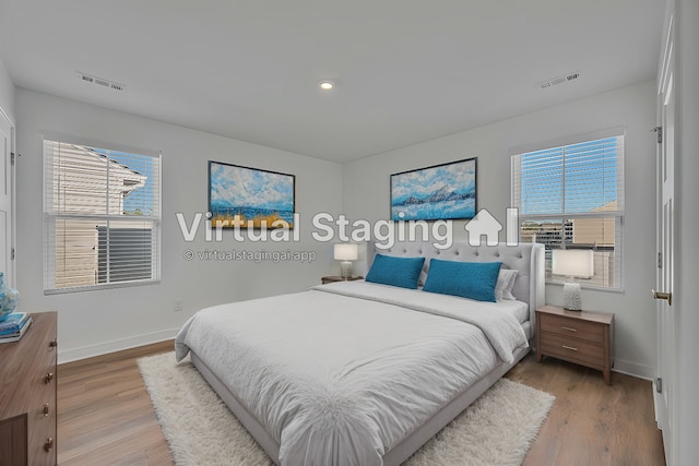 bedroom with hardwood / wood-style flooring