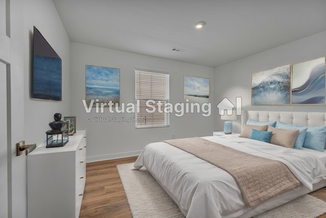 bedroom featuring hardwood / wood-style floors