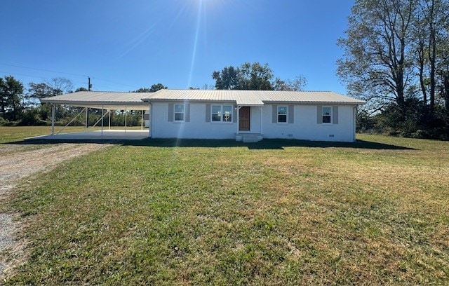 ranch-style home with a front lawn and a carport