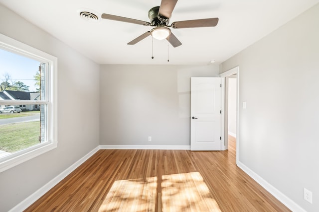 unfurnished room with light hardwood / wood-style floors and ceiling fan