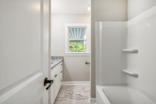 bathroom with vanity and bathtub / shower combination