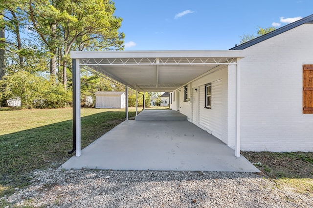 view of parking with a carport and a lawn