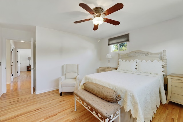 bedroom with hardwood / wood-style flooring and ceiling fan