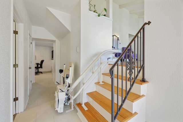 stairs with tile patterned floors