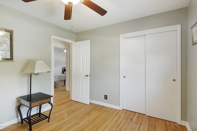 bedroom with wood-type flooring, a closet, and ceiling fan