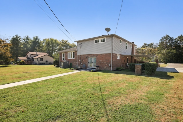 back of house featuring a yard