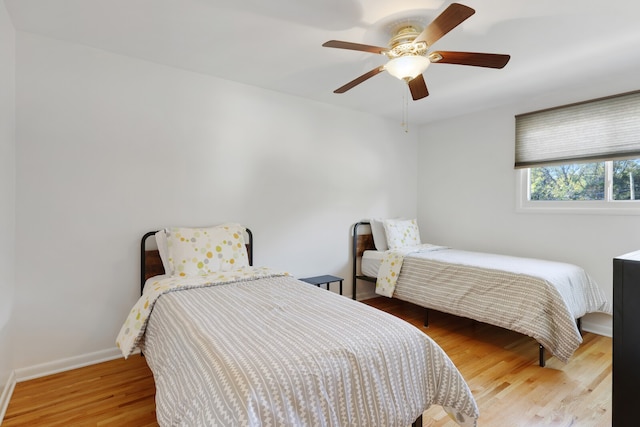 bedroom with ceiling fan and hardwood / wood-style floors