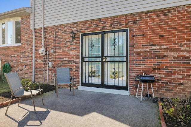 doorway to property featuring a patio and french doors