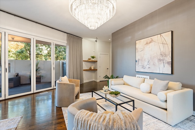 living room featuring a notable chandelier and wood-type flooring