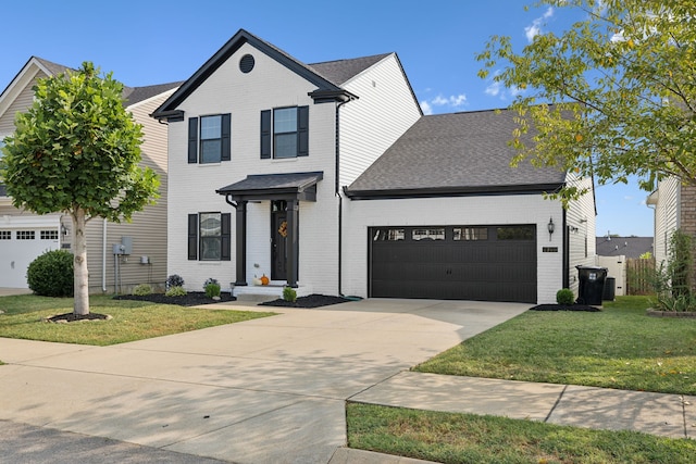 view of front facade with a front lawn and a garage