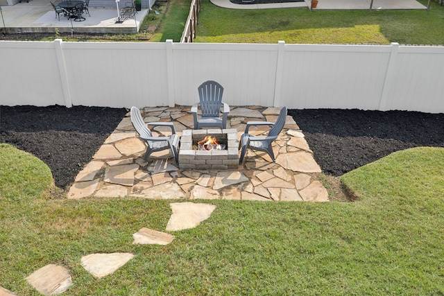 view of yard with a patio and a fire pit