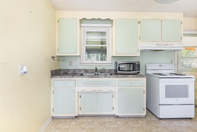 kitchen featuring a textured ceiling, sink, and electric stove