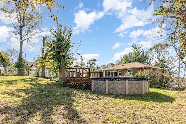 view of yard featuring a pool side deck