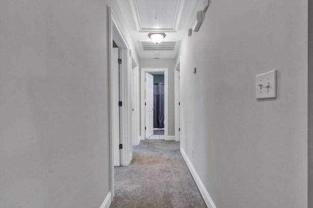 hall featuring crown molding and light colored carpet