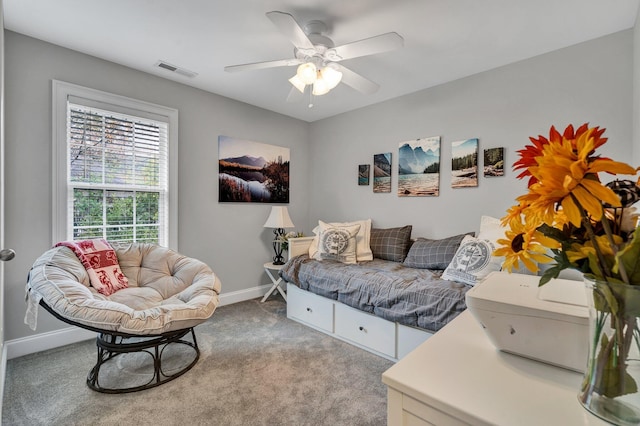 interior space with light carpet and ceiling fan