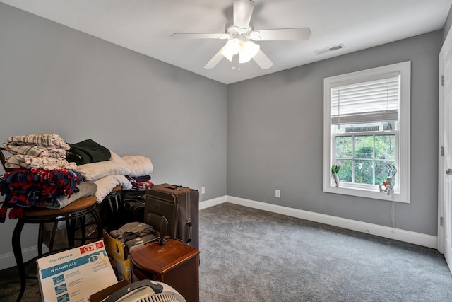 interior space with carpet floors and ceiling fan