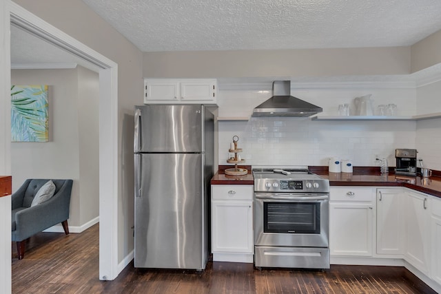 kitchen featuring stainless steel appliances, wall chimney exhaust hood, white cabinetry, and dark wood-type flooring