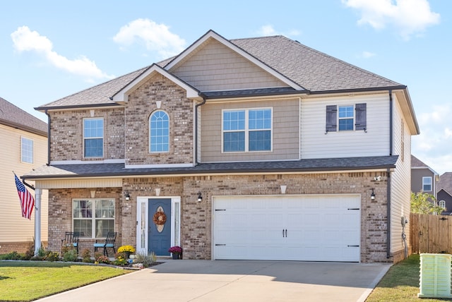 craftsman-style home with a garage and a front lawn