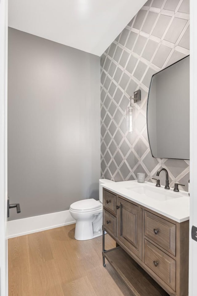 5893 Cairo Bend Rd, Lebanon, TN 37087 - bathroom with vanity, wood finished floors, toilet, and baseboards