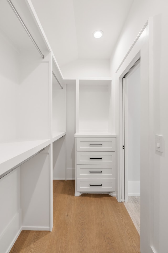 spacious closet with light hardwood / wood-style flooring