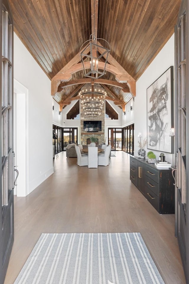 5893 Cairo Bend Rd, Lebanon, TN 37087 - sitting room featuring a chandelier, high vaulted ceiling, wood finished floors, plenty of natural light, and wood ceiling with exposed beams
