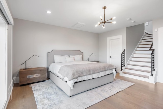 5893 Cairo Bend Rd, Lebanon, TN 37087 - bedroom featuring wood finished floors, a chandelier, baseboards, recessed lighting, and a closet