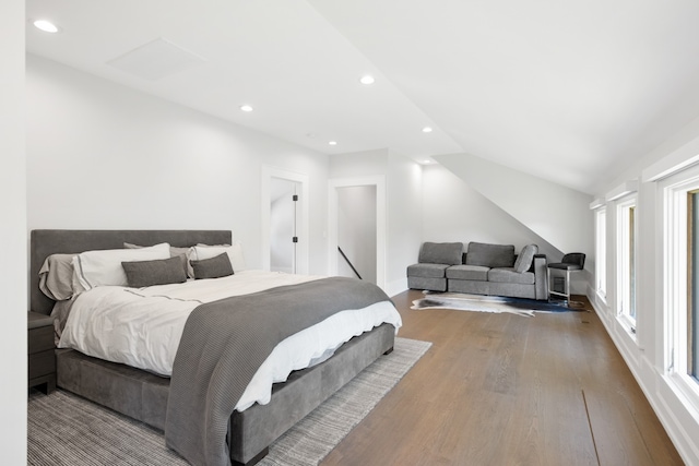 bedroom featuring lofted ceiling and hardwood / wood-style floors