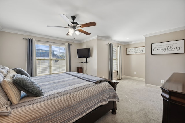 bedroom with crown molding, light colored carpet, and ceiling fan