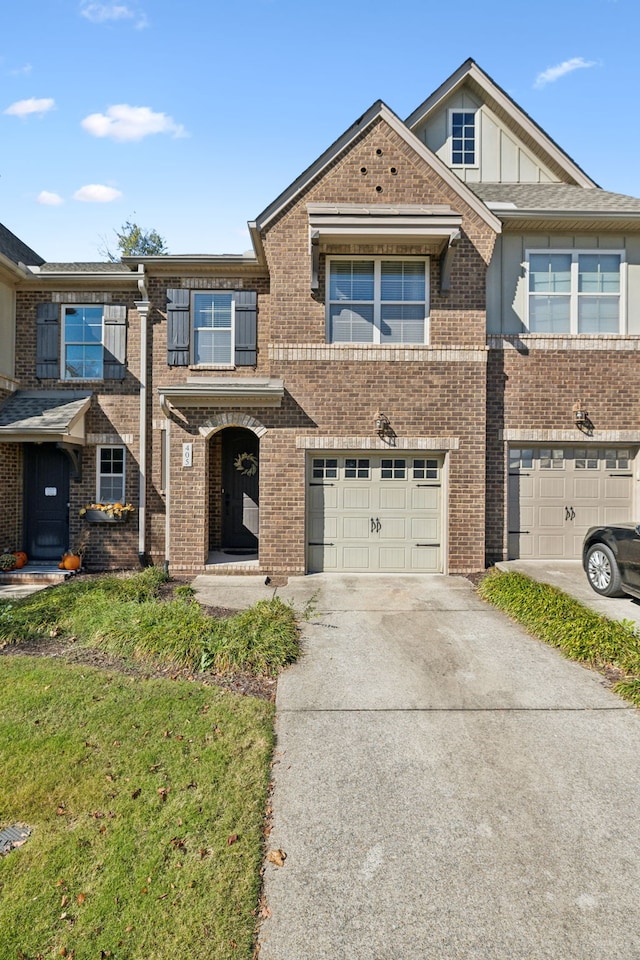 view of front facade featuring a front lawn and a garage