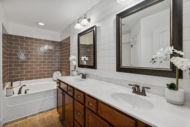 bathroom featuring a bathing tub and vanity