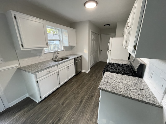 kitchen featuring sink, white cabinets, stainless steel appliances, and backsplash