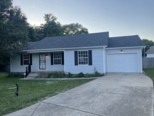 single story home with a front lawn and a garage