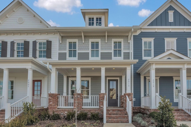 multi unit property with board and batten siding and a porch