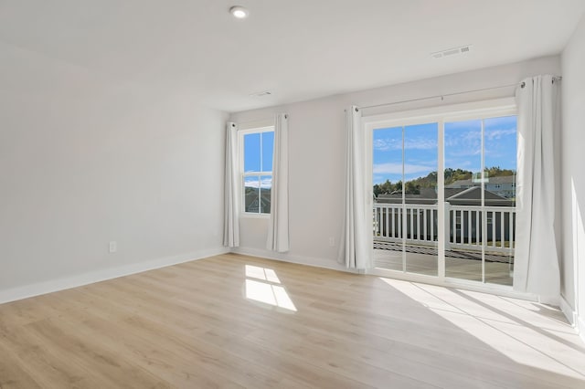 spare room with light wood-type flooring