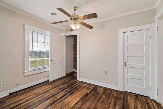 unfurnished room with crown molding, dark wood-type flooring, and ceiling fan