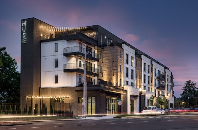 view of outdoor building at dusk