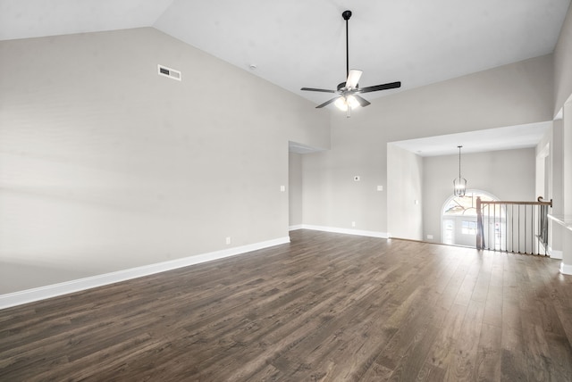 unfurnished living room with ceiling fan, dark hardwood / wood-style floors, and high vaulted ceiling